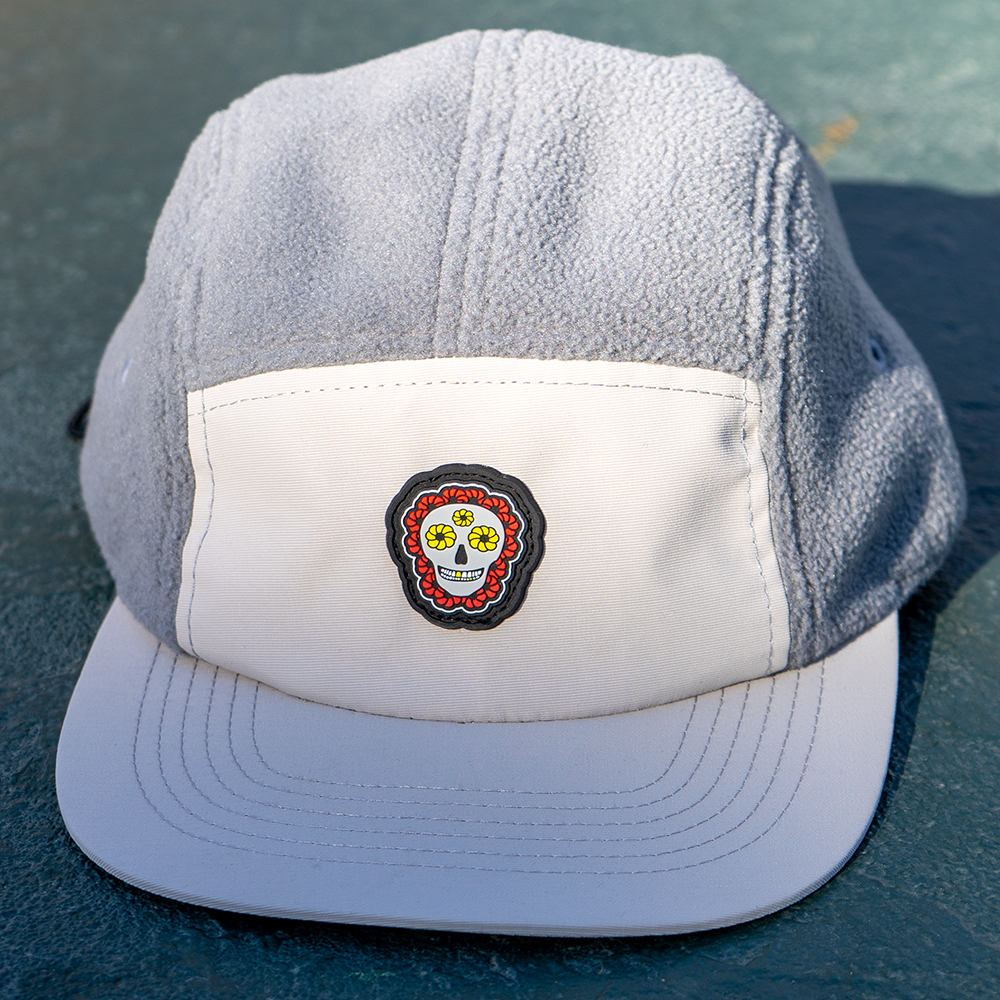 Top-down angled view of Skull Flower Fleece 5 Panel hat displaying skull flower patch