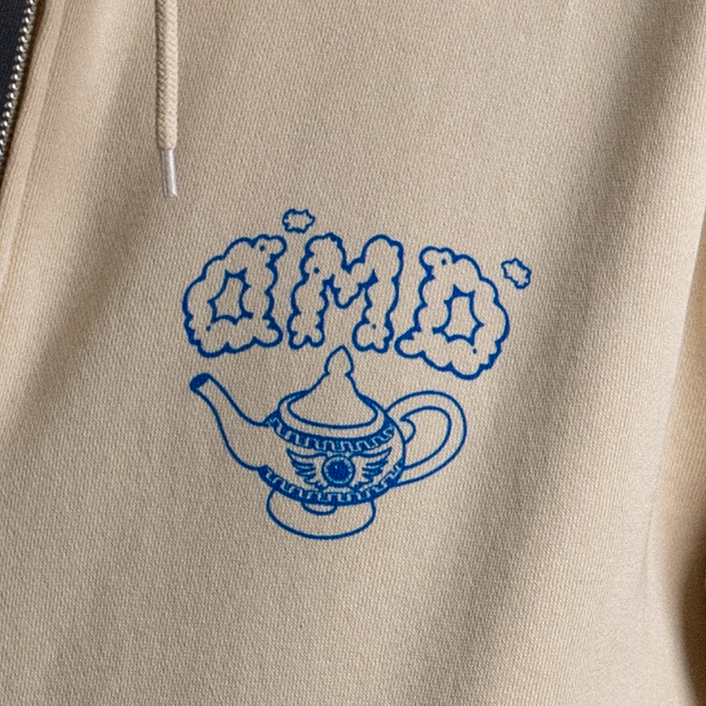 Close up of front left chest design of Be Your Own Genie zip up hoodie.