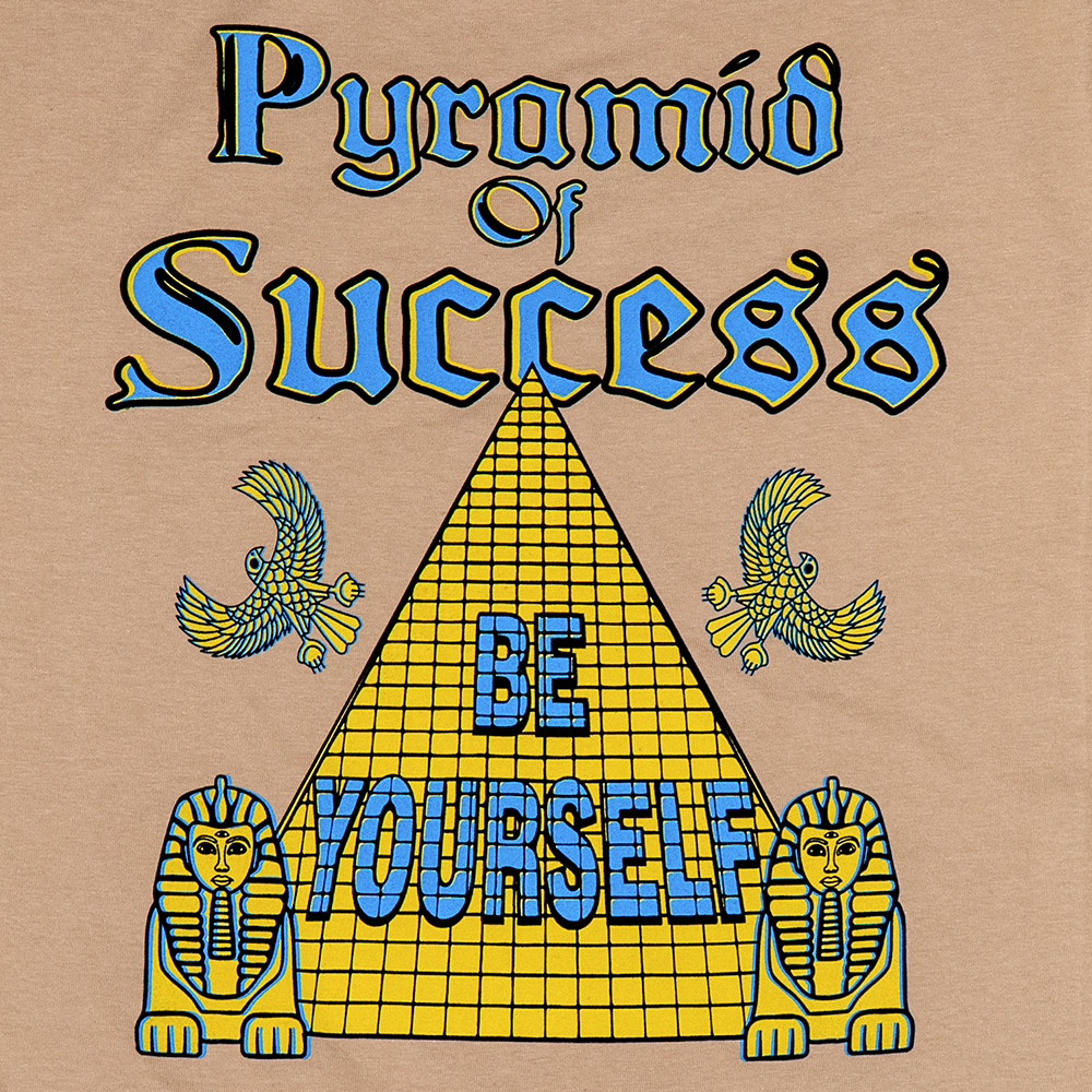 Full back print showing “Pyramid of Success” and Egyptian motifs