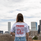 Back view of boxy white crop top with oversized sleeves