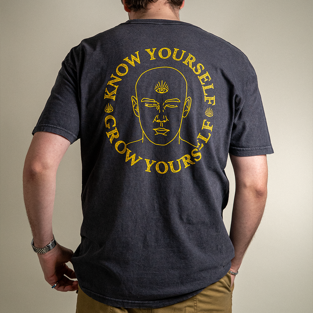 Back view of model wearing Know Yourself Grow Yourself distressed vintage Cotton Tee for Men and Women