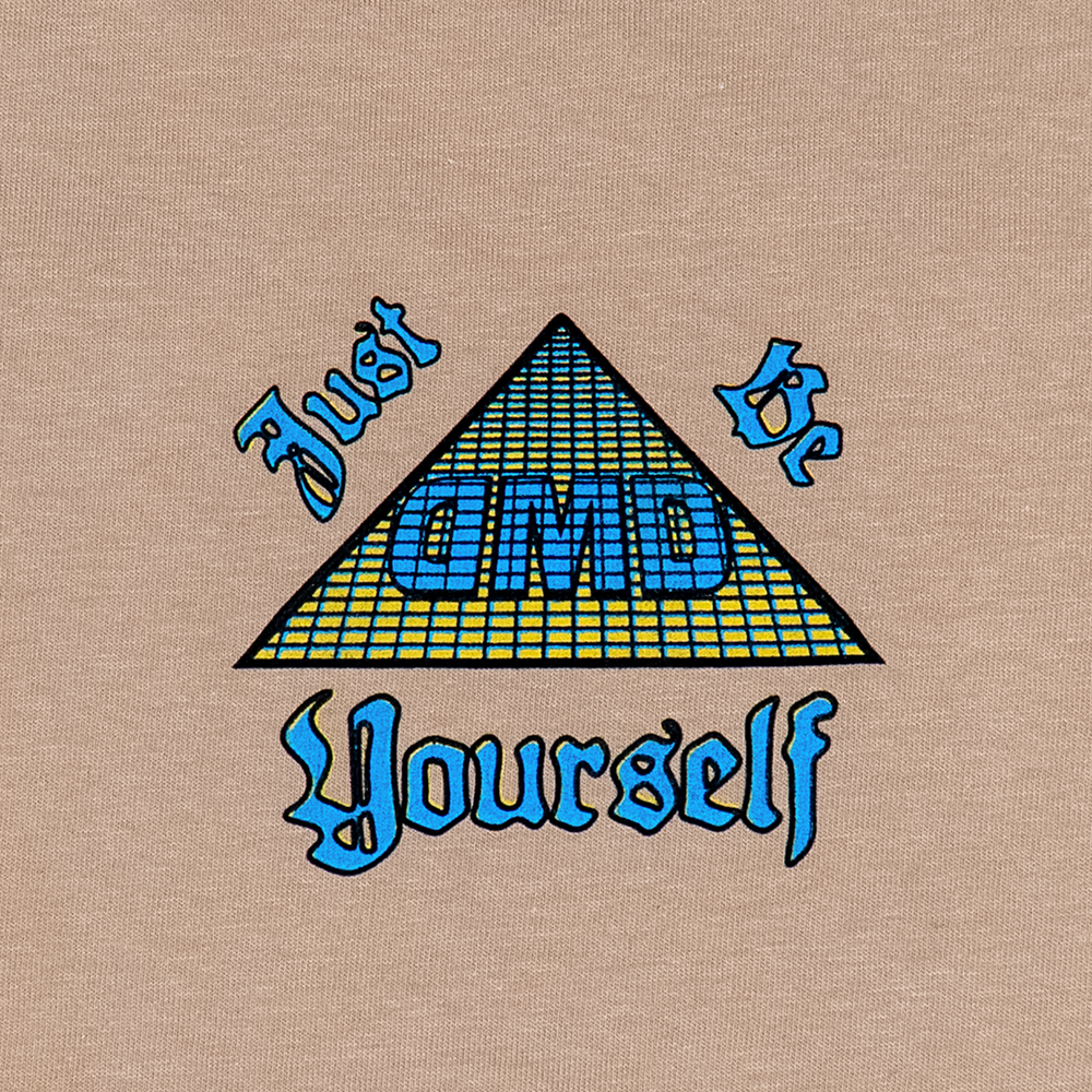Front chest detail with “Just Be Yourself” DMD pyramid logo