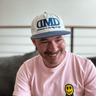 Flat bill hat made with recycled plastic – front DMD logo embroidery