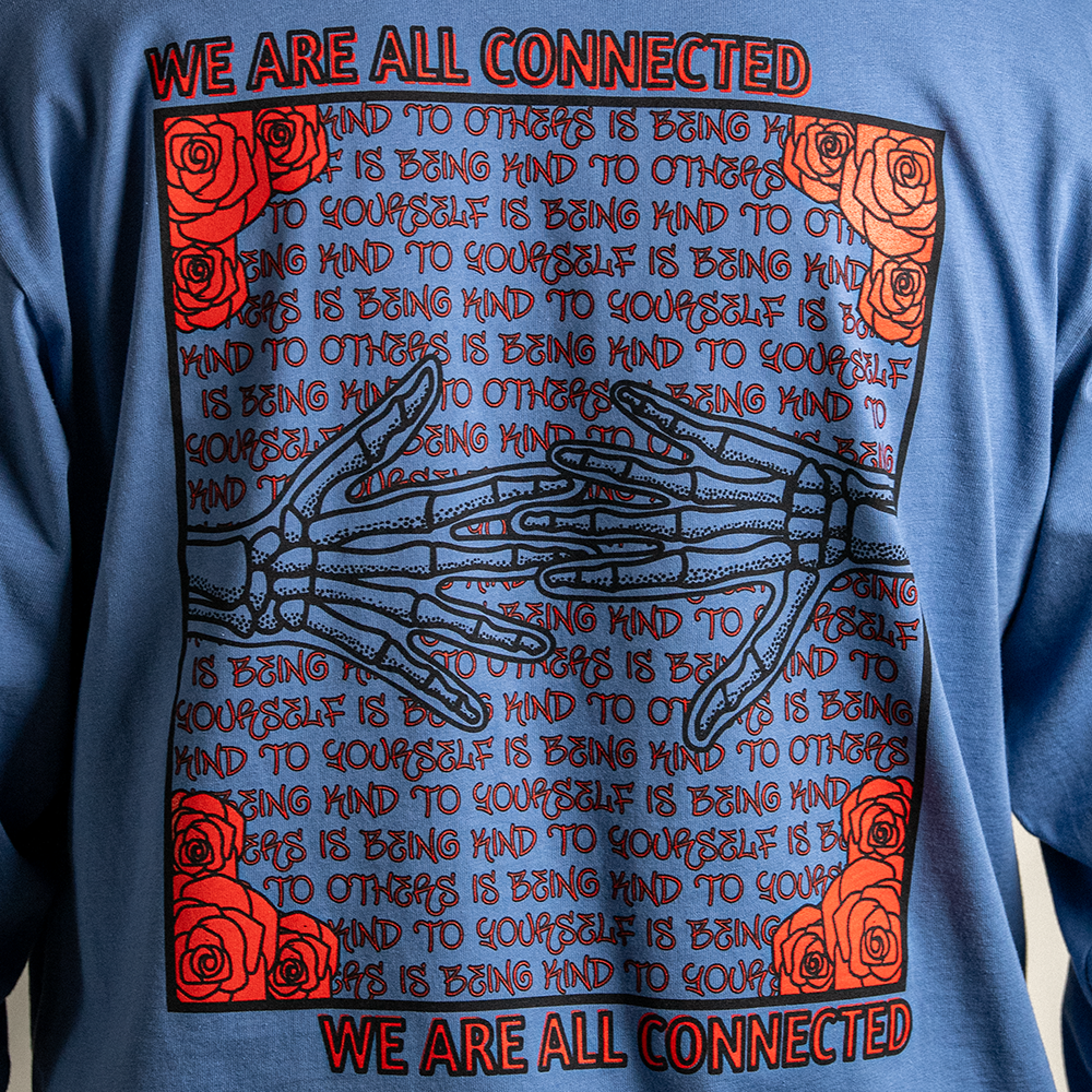 Close up of Kindness Long Sleeve Tee – back graphic showing ‘Being Kind to Others’ repeating message