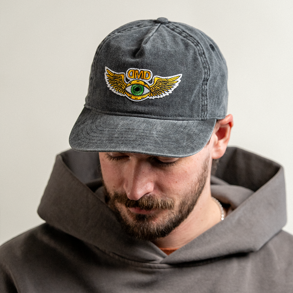 Lifestyle product photo of Third Eye Vintage Hat on model looking down