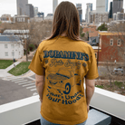 Female model wearing Under the Hood tee size S