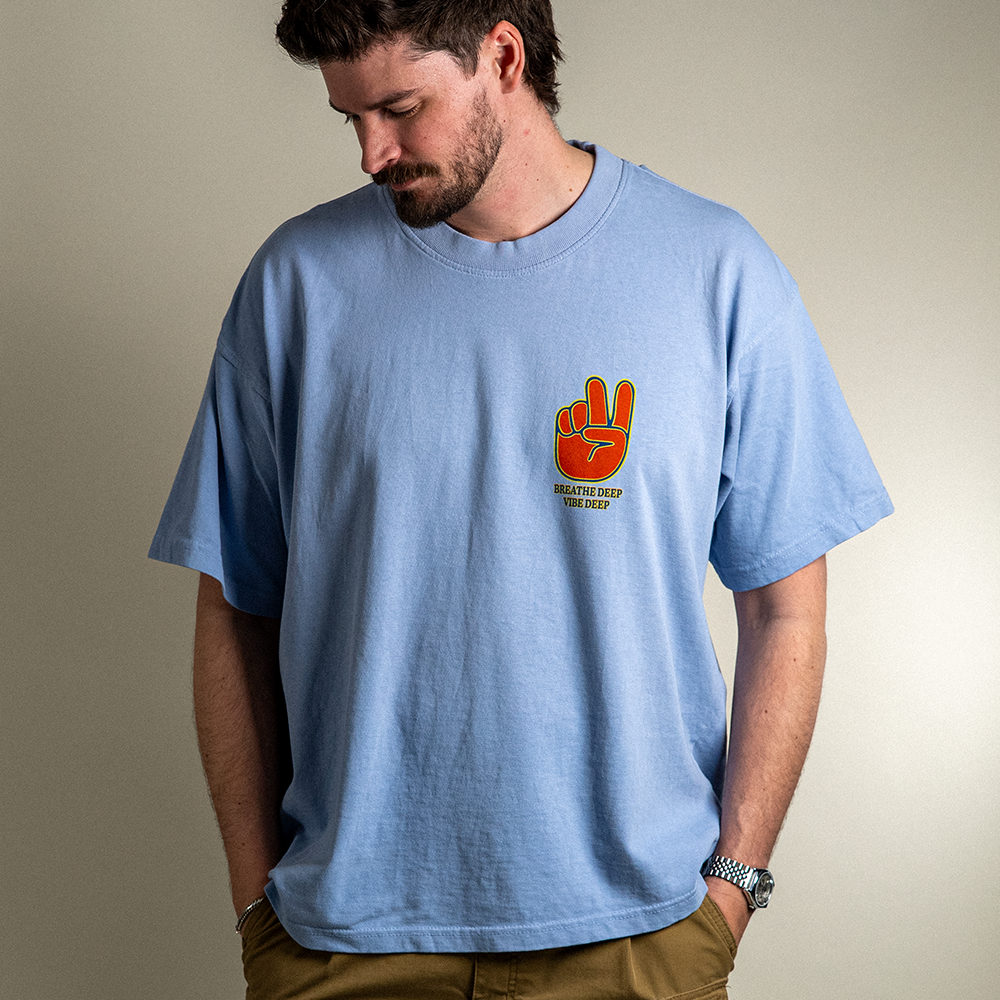 Front view of model wearing Breathe Deep Vibe Deep heavyweight cotton tee.