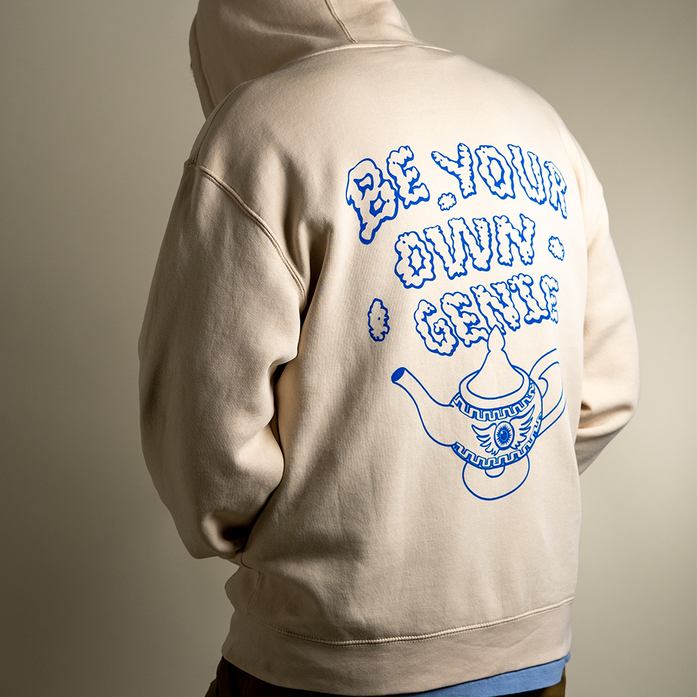 Back view Model wearing Be Your Own Genie zip up hoodie with hood up.