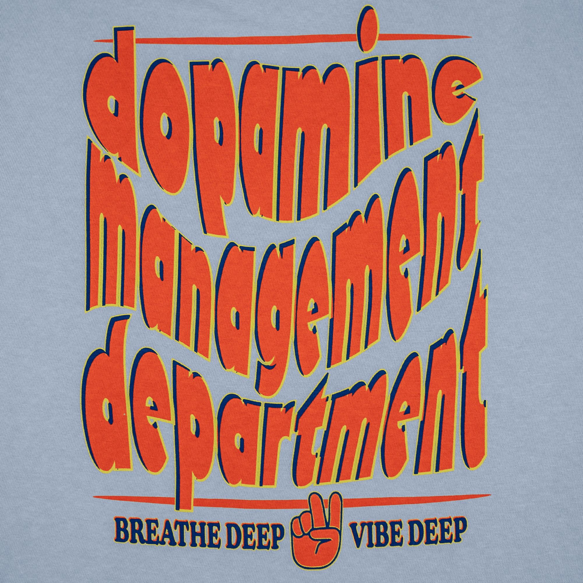 Close-up of blue cotton tee with fluid brand print