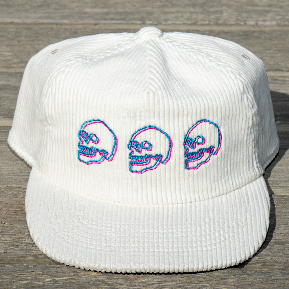 Three neon embroidered skulls on off-white vintage corduroy hat