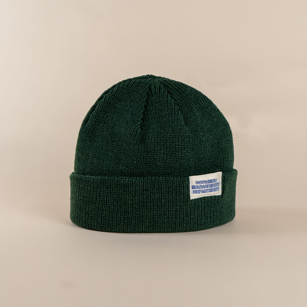 Forest green low profile recycled knit beanie front view