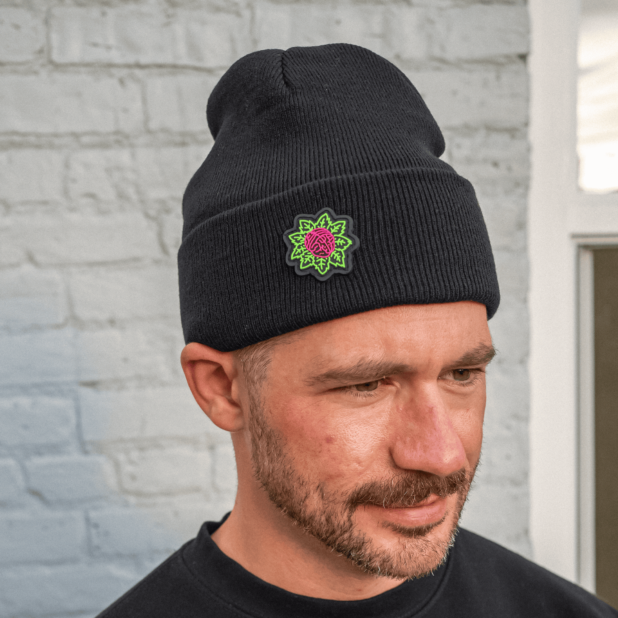 Unisex black winter beanie with thick cuff and icon patch