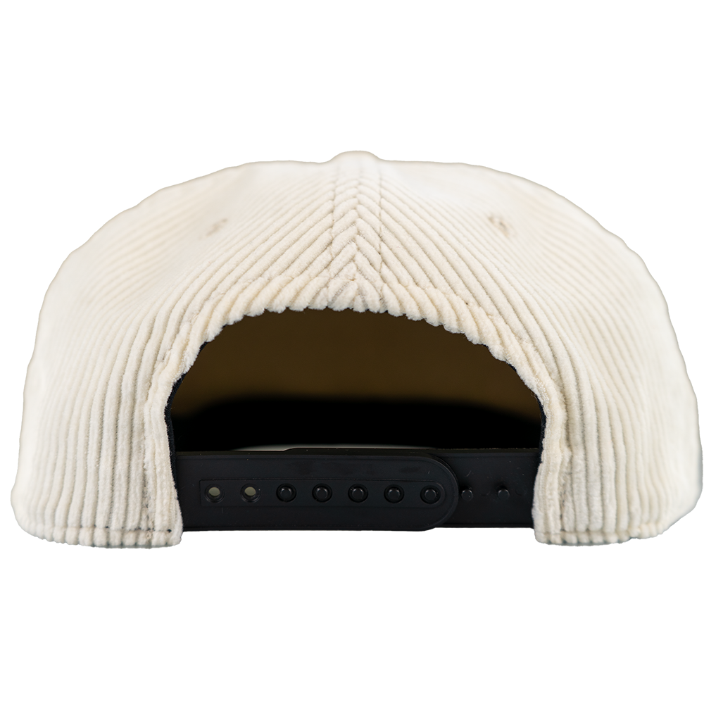 Back view of corduroy skull snapback hat with adjustable strap