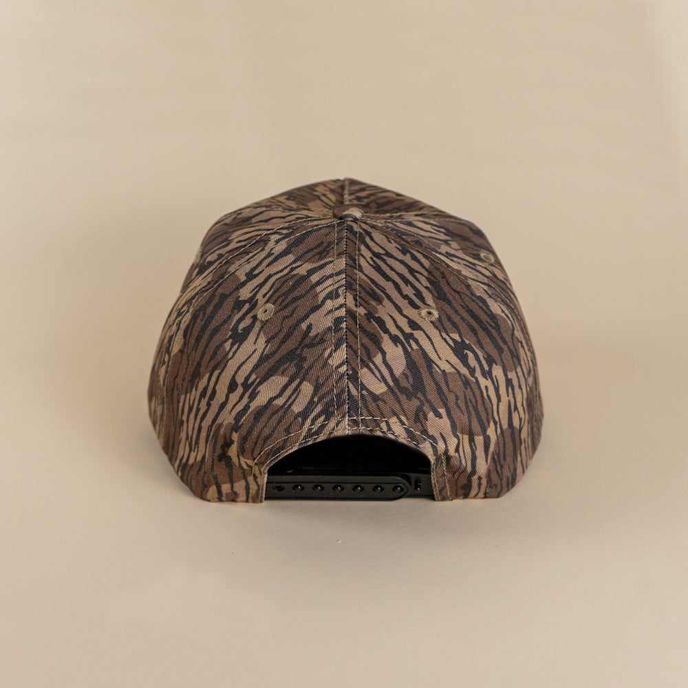 Back view woodland camo snapback with adjustable closure