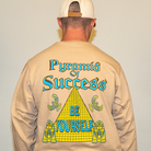 Close-up of yellow and blue pyramid design on tan cotton