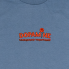 Front view of Kindness Long Sleeve Tee – Dopamine Management Department logo with rose detail on blue cotton long sleeve
