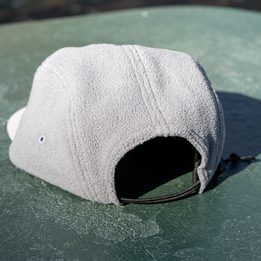 Rear angled view of Skull Flower Fleece 5 Panel hat showing soft grey fleece panels