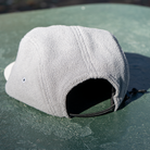 Rear angled view of Skull Flower Fleece 5 Panel hat showing soft grey fleece panels