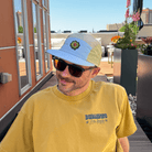 Side profile of Mindflower 5-Panel Hat with adjustable strap