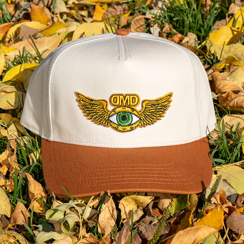 DMD Flying Eye hat photographed outdoors in natural light – sustainable streetwear