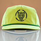 A green snapback style cotton nylon hat with a blue embroidered leopard face at the center, surrounded by text that reads 'DOPamine MANAGEMENT DEPARTMENT'. The hat has a curved brim and an adjustable snap closure.