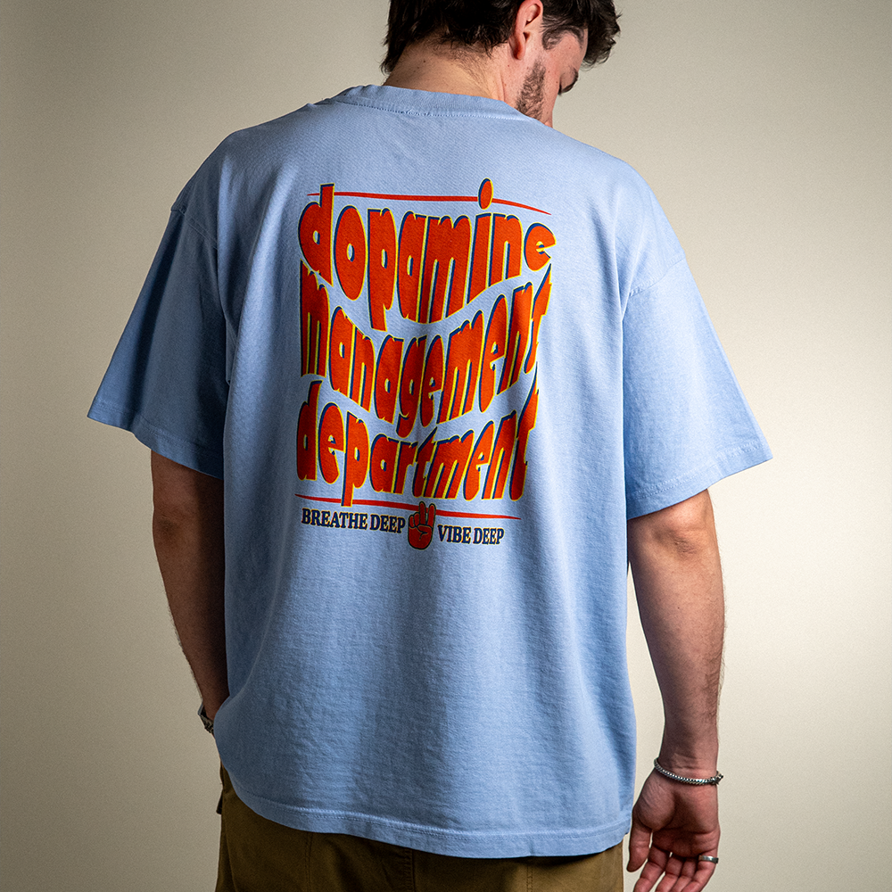 Back view of model wearing Breathe Deep Vibe Deep heavyweight cotton tee. 