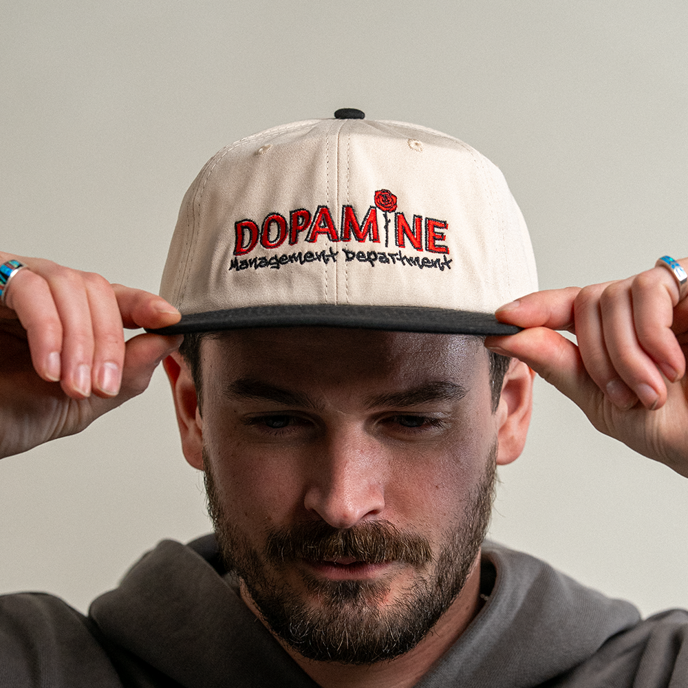 Man wearing the Rose Logo Hat in cotton canvas.