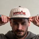 Man wearing the Rose Logo Hat in cotton canvas.