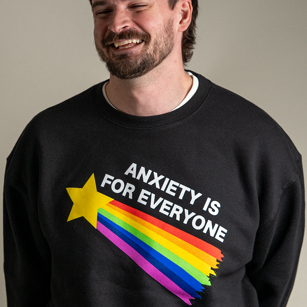 Close up of model wearing Anxiety is For Everyone crewneck sweatshirt in black