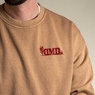 Close up of front left chest graphic on Final Frontier crewneck sweatshirt.