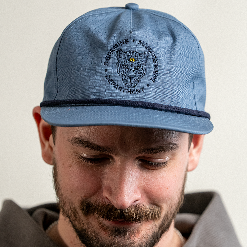 Leopard Cotton Ripstop hat in blue slate on male model looking down