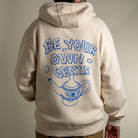 Back view Model wearing Be Your Own Genie zip up hoodie. 