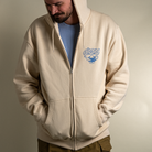 Front view of model wearing Be Your Own Genie zip up hoodie with hood up. 