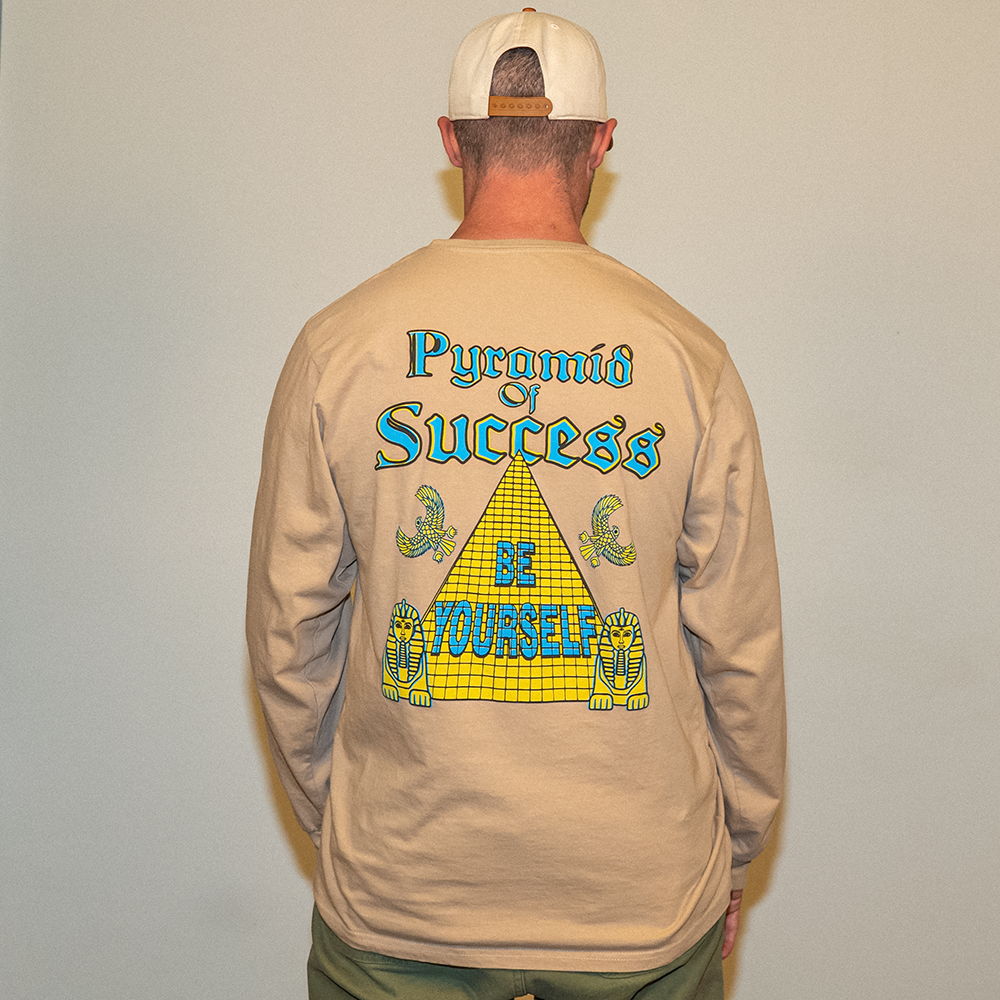 Model wearing the Pyramid of Success tee, back view