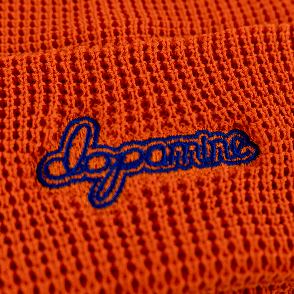 Close-up of orange Script Beanie embroidery detail