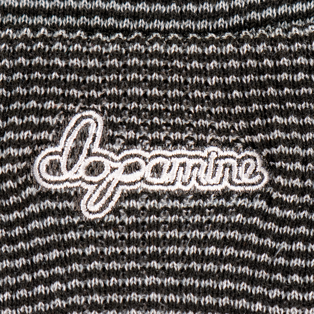 Close-up of white Script Beanie embroidery detail