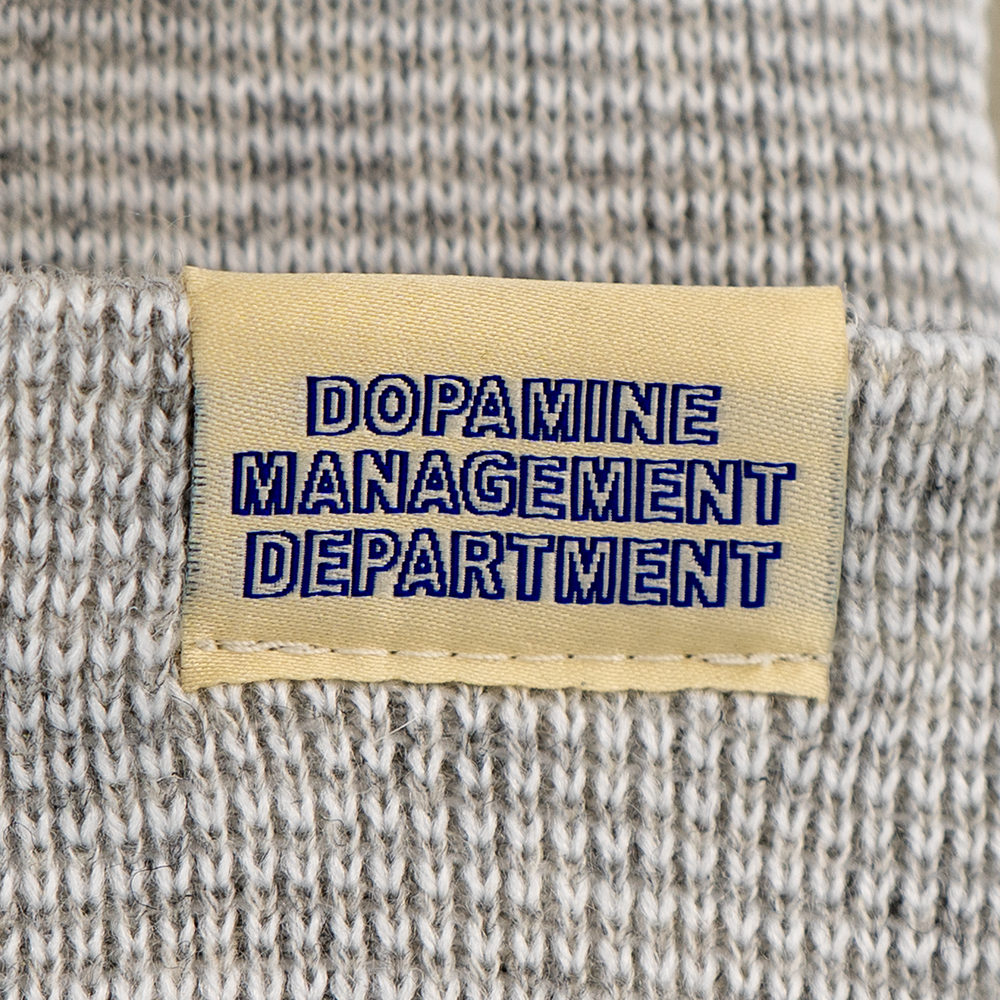Close-up of woven label on Heather Beanie in deep blue print