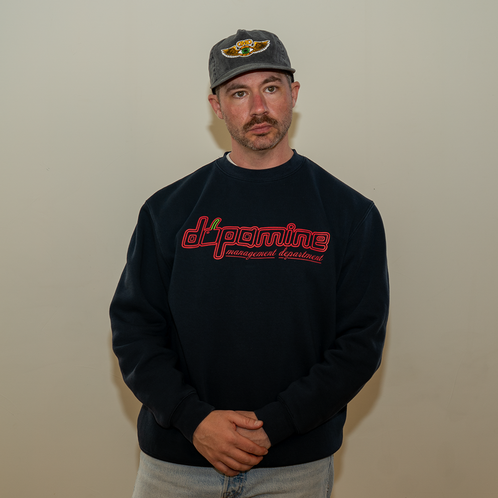 Model in Dopamine Management Department cherry logo sweatshirt
