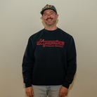 Smiling model in Dopamine Management Department cherry logo sweatshirt