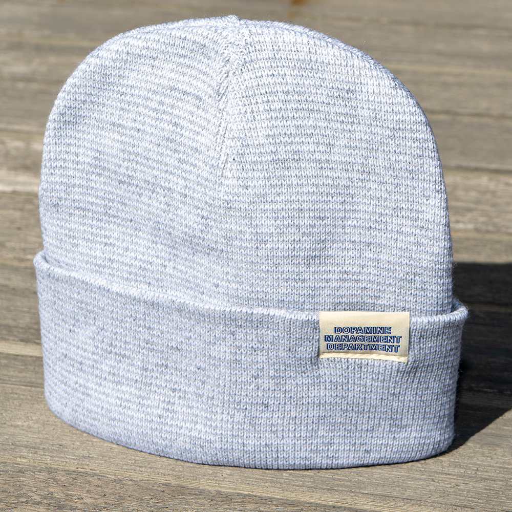 Heather Beanie displayed outdoors on wooden surface