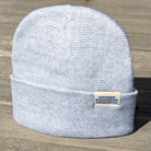 Heather Beanie displayed outdoors on wooden surface