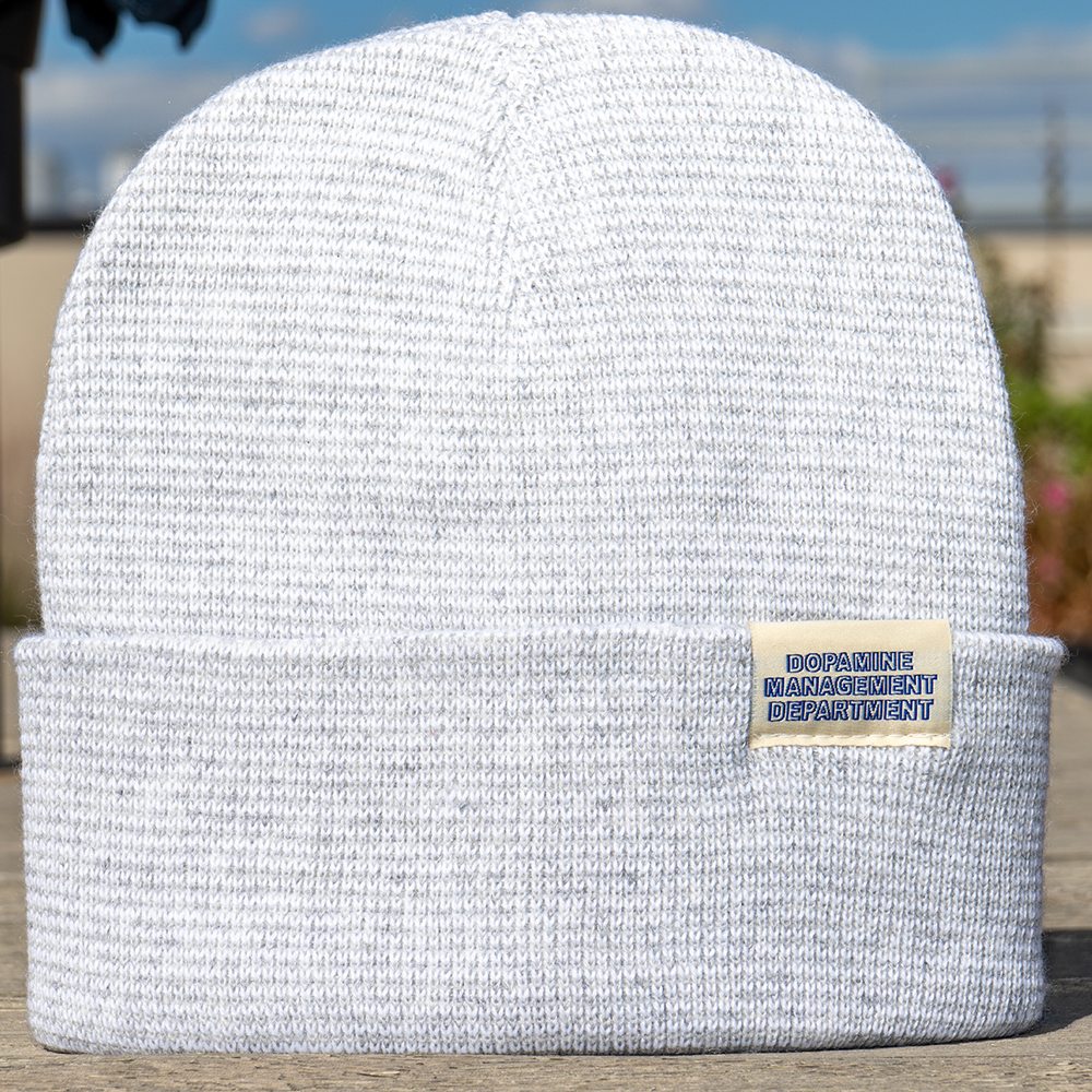Heather Beanie displayed outdoors on wooden surface