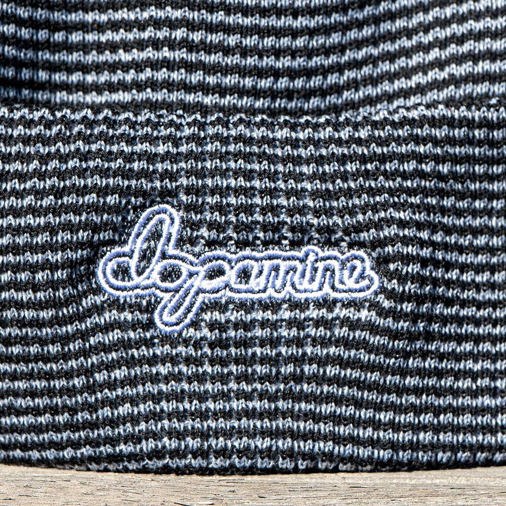 Close-up of white Script Beanie embroidery detail