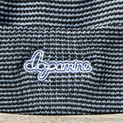Close-up of white Script Beanie embroidery detail