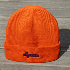 Orange Script Beanie with embroidered “dopamine” text – front view