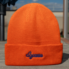 Orange Script Beanie with embroidered “dopamine” text – front view