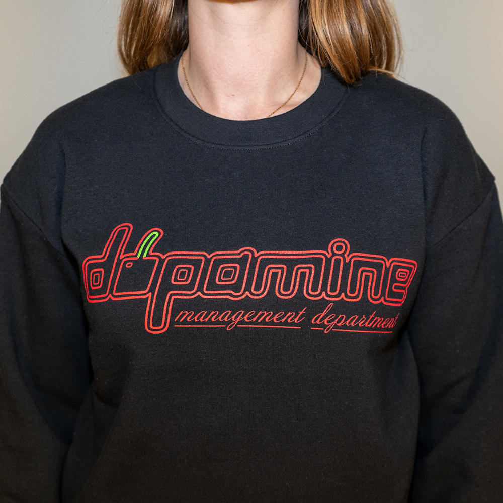 Front view of women’s black fleece sweatshirt with cherry dopamine graphic