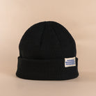 Black cropped low profile beanie designed to sit above the ear