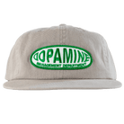 Beige cap with green and white 'Dopamine Management Department' logo on a transparent background