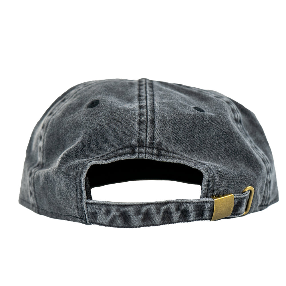 back of black vintage wash cap with adjustable strap and brass holder.